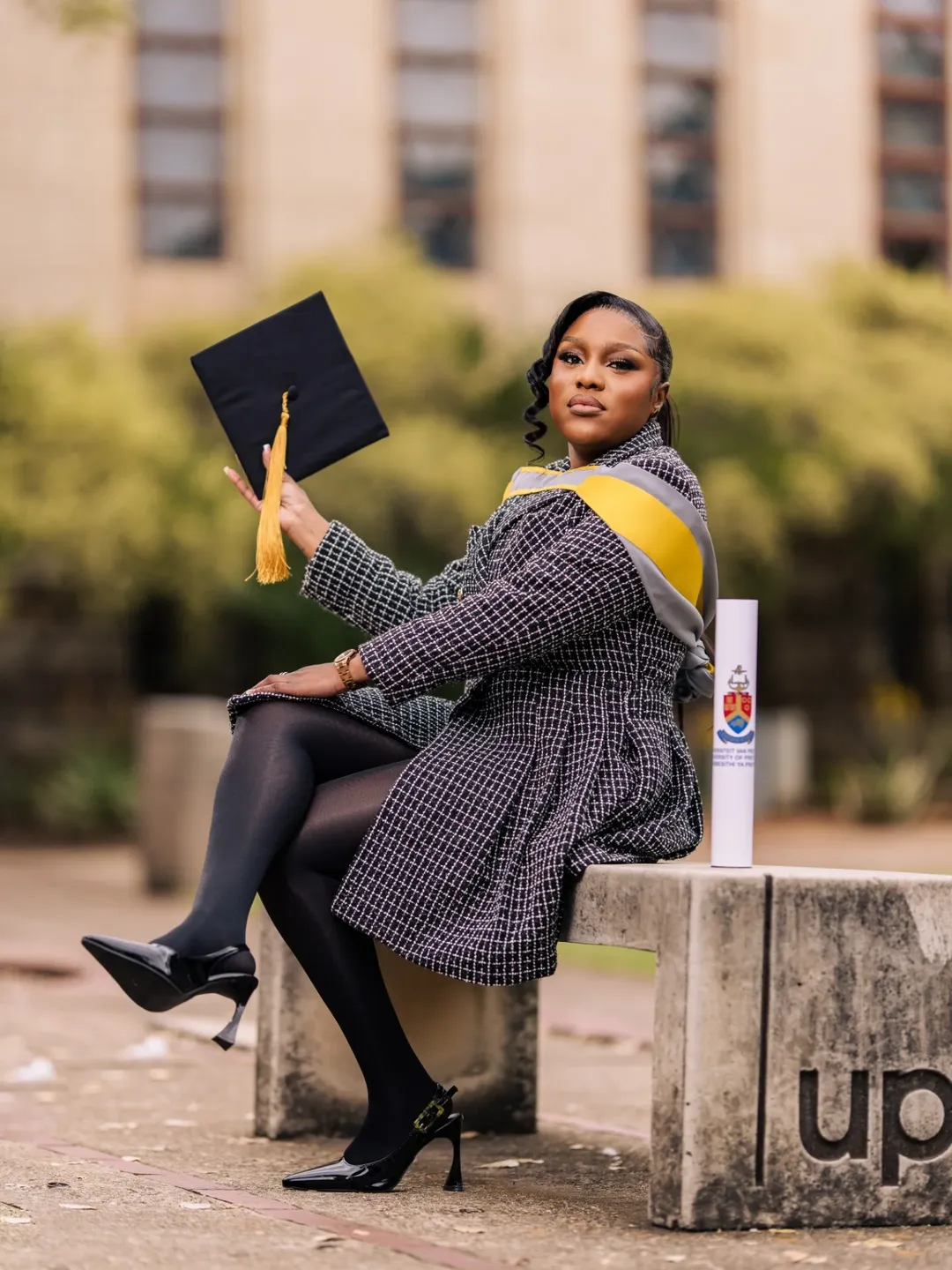 Graduation portrait — campus backdrop, editorial styling