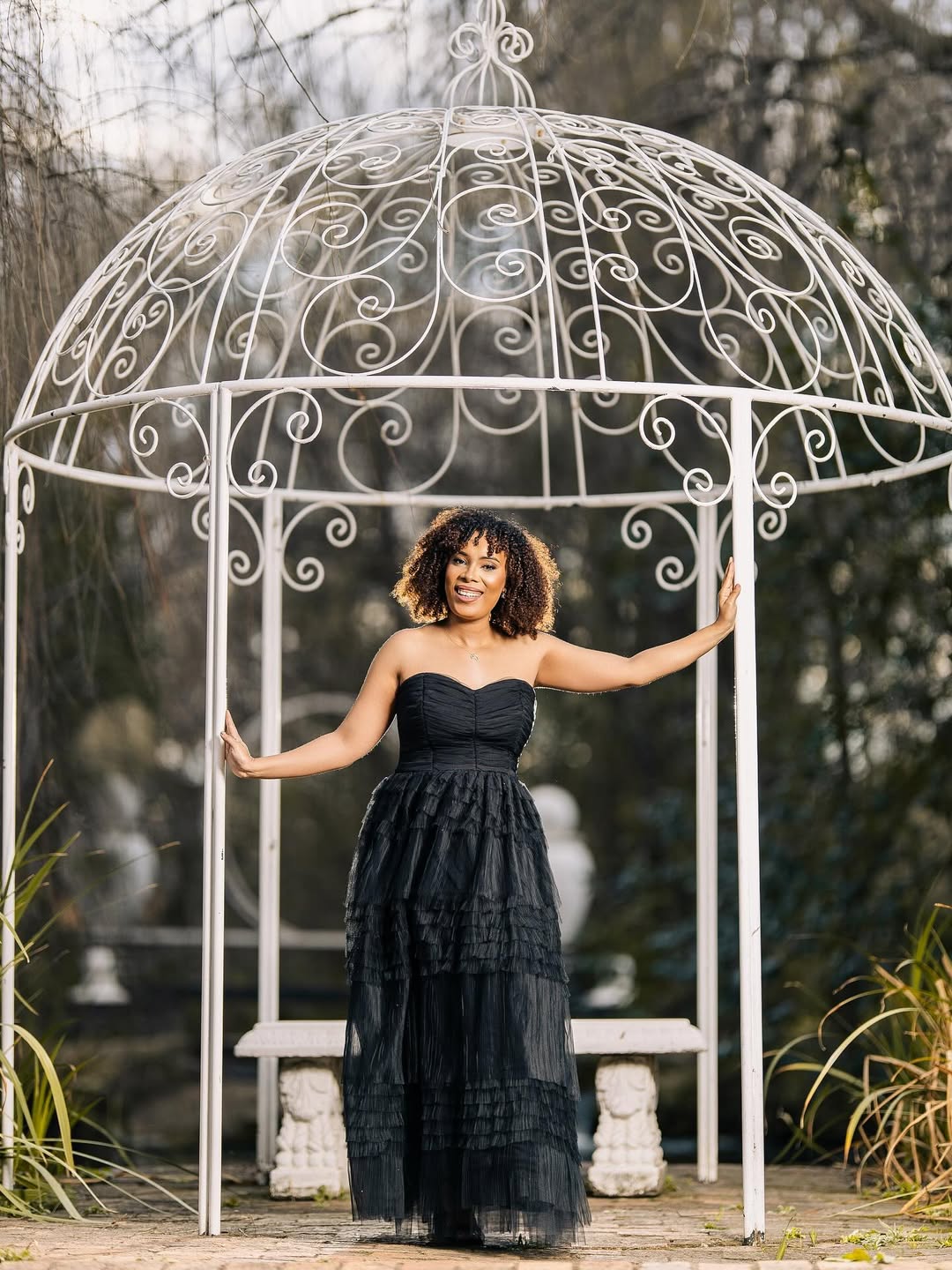 Lifestyle session — black tulle gown beneath a white garden gazebo